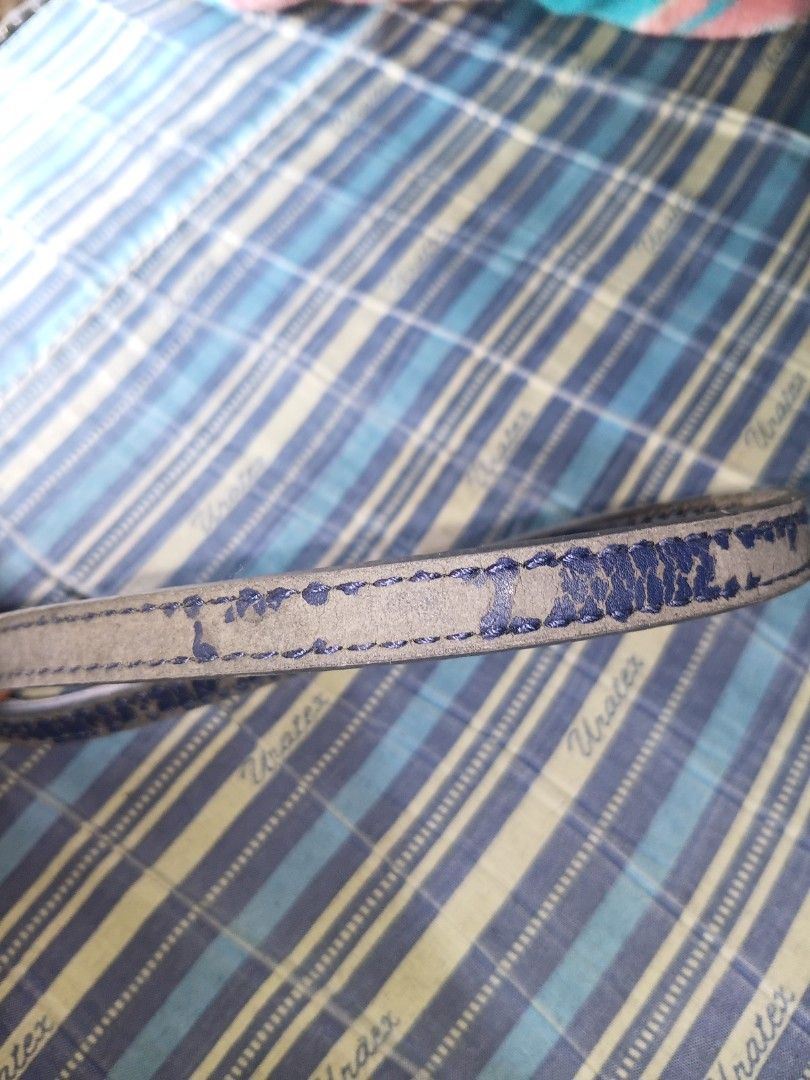 Tommy Hilfiger Cross Body Bag (Category: Purses & Pouches) located in Manila. Submitted by keenphoenix_9ed053 (Listing ID 1465757857, Image 2). Description: - Stylish blue and beige monogram pattern - Secure top zip closure to keep items safe - Compact size, perfect for organizing makeup or small essentials in your bag - Faux leather interior tag details (Production Date: 08/17, Style Code: BW96942605 GDC-KOF) - Pre-loved and well-maintained.