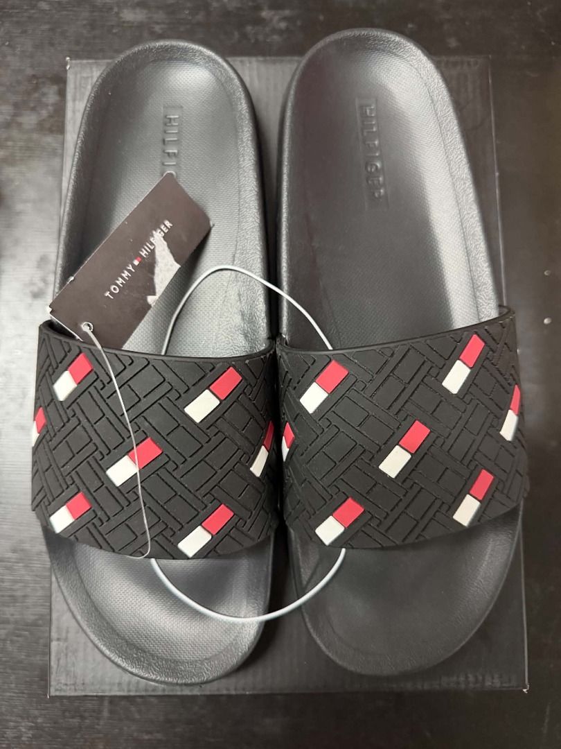 Tommy Hilfiger Slides Black Red White (Category: Slippers and slides) located in Minglanilla. Submitted by dthreestore (Listing ID 1465756309, Image 2). Description: Brand new Tommy Hilfiger black slide sandals featuring a stylish red, white, and black textured strap and a comfortable contoured footbed. Comes with tags attached. 100% authentic! ▪︎Php 1,250 ▪︎Brand New Authentic ▪︎Follow us on Facebook: D3 Store ▪︎Mode of Payment: Cash/Gcash 🚚 Ma