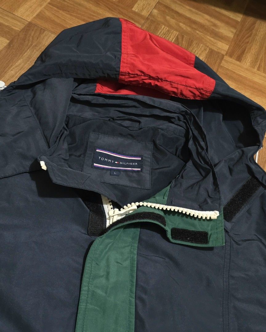 Tommy Hilfiger Windbreaker (Category: Activewear) located in Manila. Submitted by gilbert0522 (Listing ID 1465654791, Image 2). Description: •Tommy Hilfiger Windbreaker (RARE colorway) • Color rate: 10/10 • Issue: None • Size: 23x29 • NEGOTIABLE TO SURE BUYER YOU CAN CHECK MY OTHER LISTINGS 👕 All Authentic/Original Preloved from South Korea 📍Sampaloc, Manila 🚚 JNT/Lalamove.