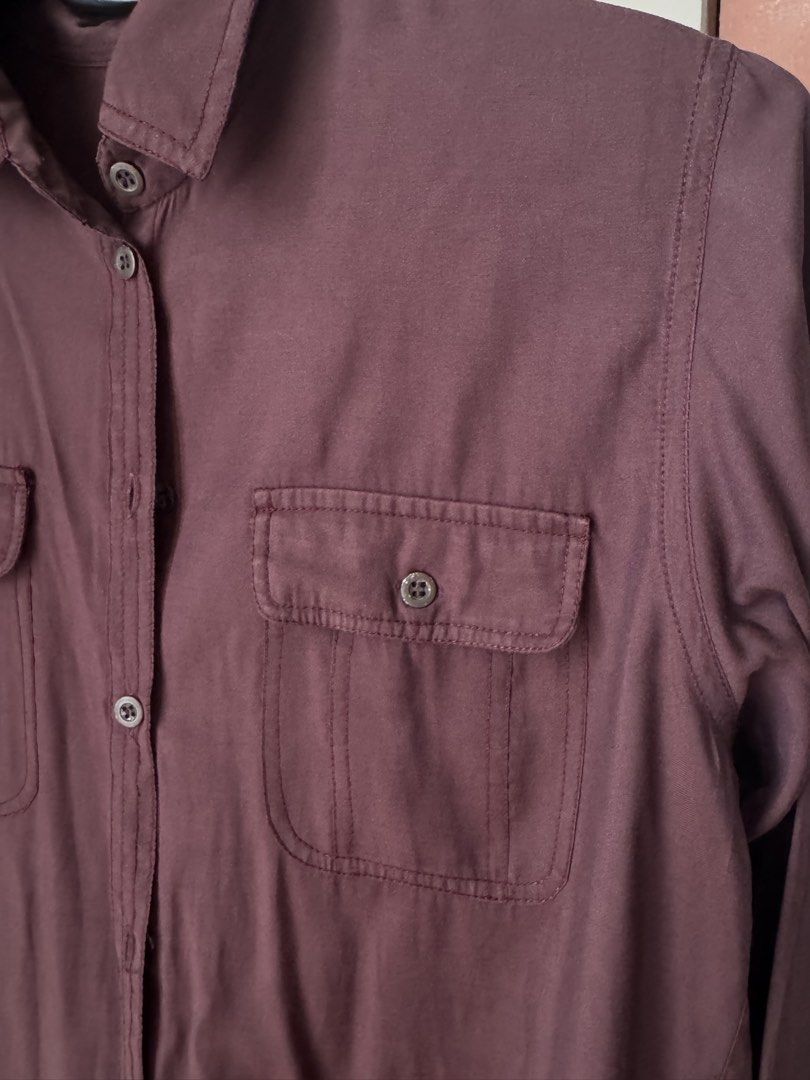 Topshop Burgundy Long Sleeve Button Down (Category: Longsleeves) located in Pasig City. Submitted by kutleyn (Listing ID 1465656707, Image 3). Description: - Brand: Topshop - Color: Rich burgundy - Size: EUR 34 / US 2 / UK 6 - Features: Long sleeves, chest pockets, classic collar, and front button placket - Material: Lightweight and versatile - Condition: Clean, excellent pre-loved condition.