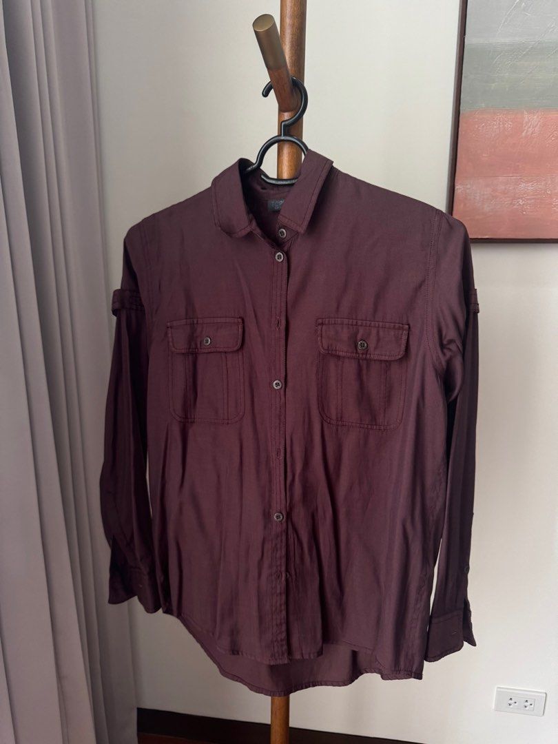 Topshop Burgundy Long Sleeve Button Down (Category: Longsleeves) located in Pasig City. Submitted by kutleyn (Listing ID 1465656707, Image 1). Description: - Brand: Topshop - Color: Rich burgundy - Size: EUR 34 / US 2 / UK 6 - Features: Long sleeves, chest pockets, classic collar, and front button placket - Material: Lightweight and versatile - Condition: Clean, excellent pre-loved condition.