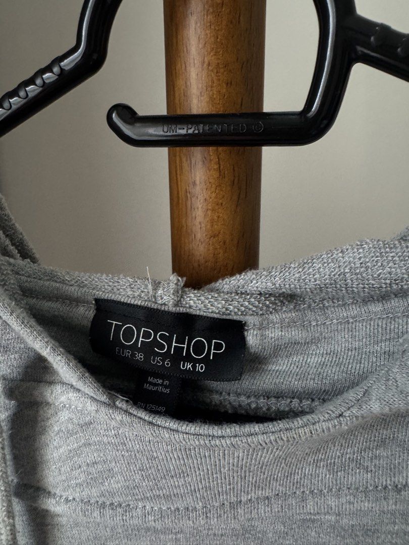 Topshop Grey Hooded Sweatshirt (Category: Coats, Jackets and Outerwear) located in Pasig City. Submitted by kutleyn (Listing ID 1465671942, Image 2). Description: - Brand: Topshop - Color: Grey - Style: Pullover hoodie with adjustable drawstring - Features: Practical front pocket - Size: US 6, UK 10, EUR 38 - Condition: Great for casual, everyday wear.