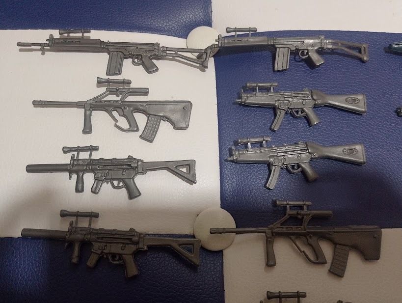 Toy gun and weapon accessories bundle (Category: Action & Battle Toys) located in Quezon City. Submitted by susmaryosep1 (Listing ID 1465656533, Image 2). Description: - Bundle of plastic toy weapons and accessories - Includes assault rifles, shotguns, pistols, knives, throwing stars, and axes - Colors: Gray, dark green, and blue - Perfect for custom action figure setups and dioramas - Sizes range from 2 inches (pistols) to 6 inches (larger rifle