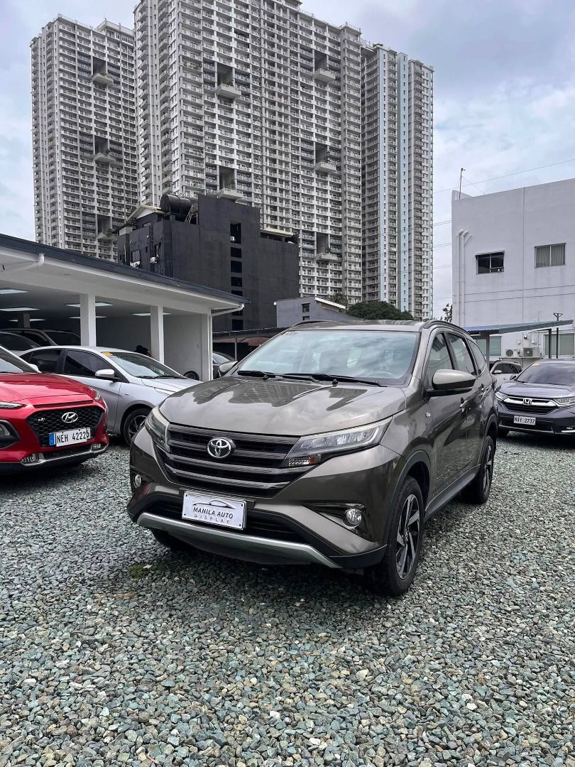 Toyota Rush G 1.5L Auto (Category: Used Cars) located in Pasig City. Submitted by pureocean-057512 (Listing ID 1465665519, Image 3). Description: 2020 TOYOTA RUSH 1.5L G GAS AUTOMATIC TRANSMISSION Downpayment: ₱65,800 ✅ ZERO PROCESSING UNTIL OCT 17 ONLY ✅ ⚠️5 SLOTS LEFT ONLY⚠️ Bronze Mica Metallic 26tkms mileage Automatic Transmission 1.5L Gasoline Engine 3 ending plate Spacious 7 seater Touch Screen with FM/USB/Aux/Bluetooth Anti-lock Braking Sy