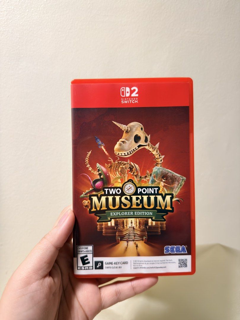 Two Point Museum Explorer Edition Nintendo Switch 2 (Category: Nintendo) located in Rizal. Submitted by jynnnncd (Listing ID 1465736980, Image 1). Description: - Title: Two Point Museum Explorer Edition - Platform: Nintendo Switch 2 - Format: Physical game case with cartridge included (Game-key card version requiring download) - ESRB Rating: E for Everyone - Condition: Red plastic case in clean condition, opened only to check contents.