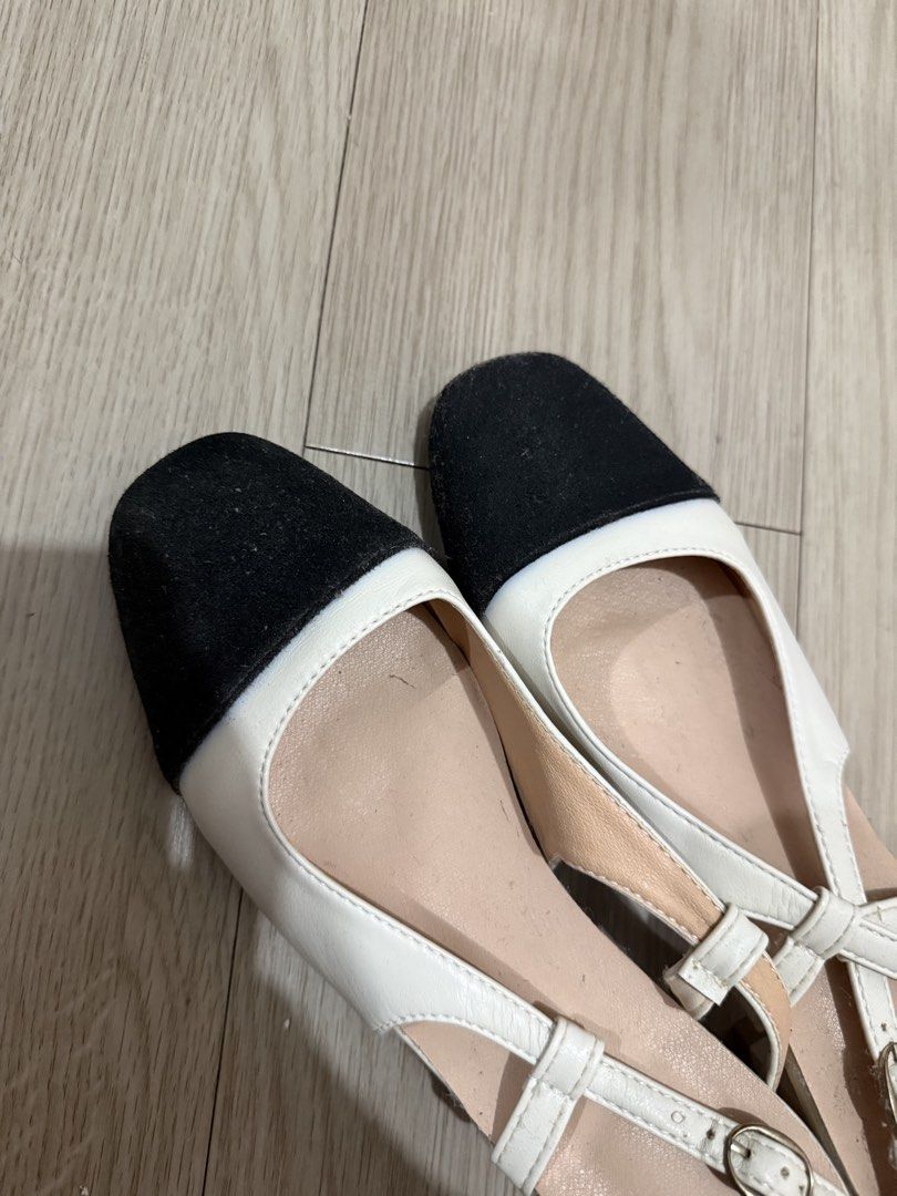 Two-tone Black and White Slingback Heels (Category: Heels) located in Manila. Submitted by aaaine (Listing ID 1465755741, Image 2). Description: - Color: Classic black and white two-tone design - Toe Style: Closed square toe - Heel: Comfortable low block heel - Fit: Adjustable buckle strap at the back heel with stylish crisscross side straps - Interior: Neutral beige inner lining - Condition: Brand new / Excellent quality - Perfect for: Office we