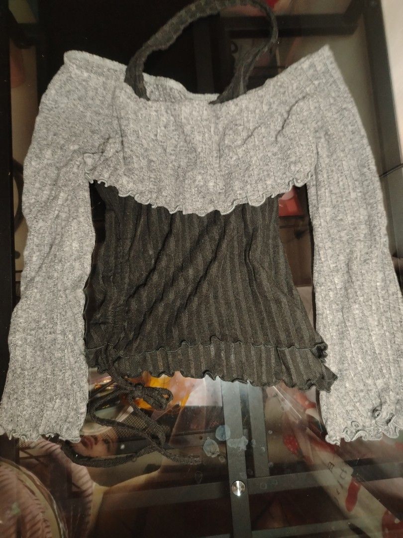 Two-tone Off-shoulder Halter Ribbed Knit Top (Category: Longsleeves) located in Manila. Submitted by silver.springs (Listing ID 1465682082, Image 1). Description: - Trendy layered look featuring a grey off-shoulder top and dark grey ribbed bodice - Secured with a stylish halter strap - Cute lettuce hem details on cuffs and bottom edge - Adjustable side tie strings at the hip for a custom fit - Made from super soft and stretchy fabric - Ideal for 