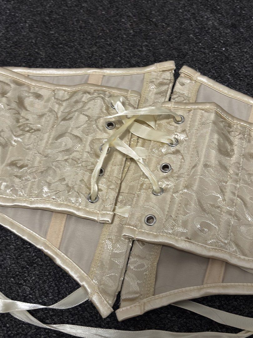 Underbust Corset (Category: Sleeveless) located in Muntinlupa City. Submitted by angeliqvn (Listing ID 1465738515, Image 2). Description: Perfect for Halloween - Style: Underbust corset with a chic floral damask pattern - Closure: Front metal busk with four silver clasps - Support: Structured vertical boning panels on front and sides - Design: Curved top edge and flattering dipped hemline - Material: Heavy fabric with a subtle sheen - Condition: 