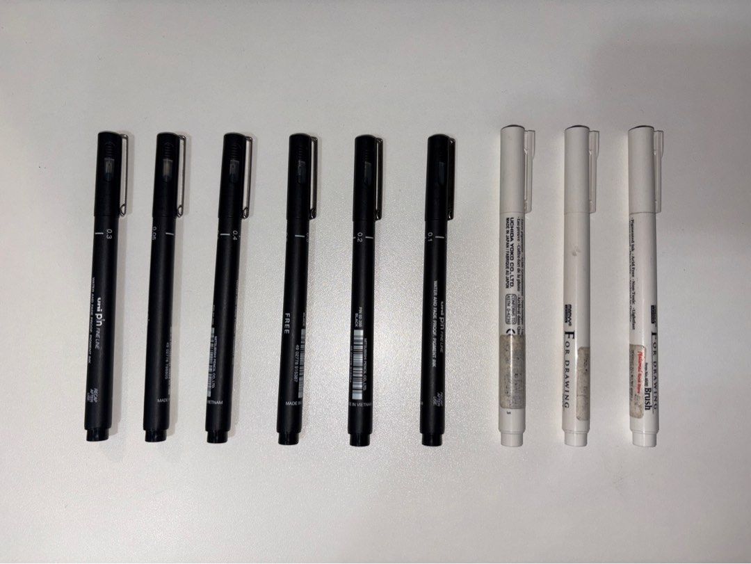 Uni Pin and Marvy Uchida Drawing Pens Set (Category: Stationery & School Supplies) located in Quezon City. Submitted by vvelcometomyshop (Listing ID 1465755500, Image 1). Description: - Product: Black and White Drawing Pen Bundle - Uni Pin Fineliners: 6 pieces in various tip sizes (0.1, 0.2, 0.3, 0.4, 0.5) - Marvy Uchida For Drawing Pens: 3 white pens included, featuring a brush tip - Ink Condition: Excellent ink flow on all pens - Note: Minor we