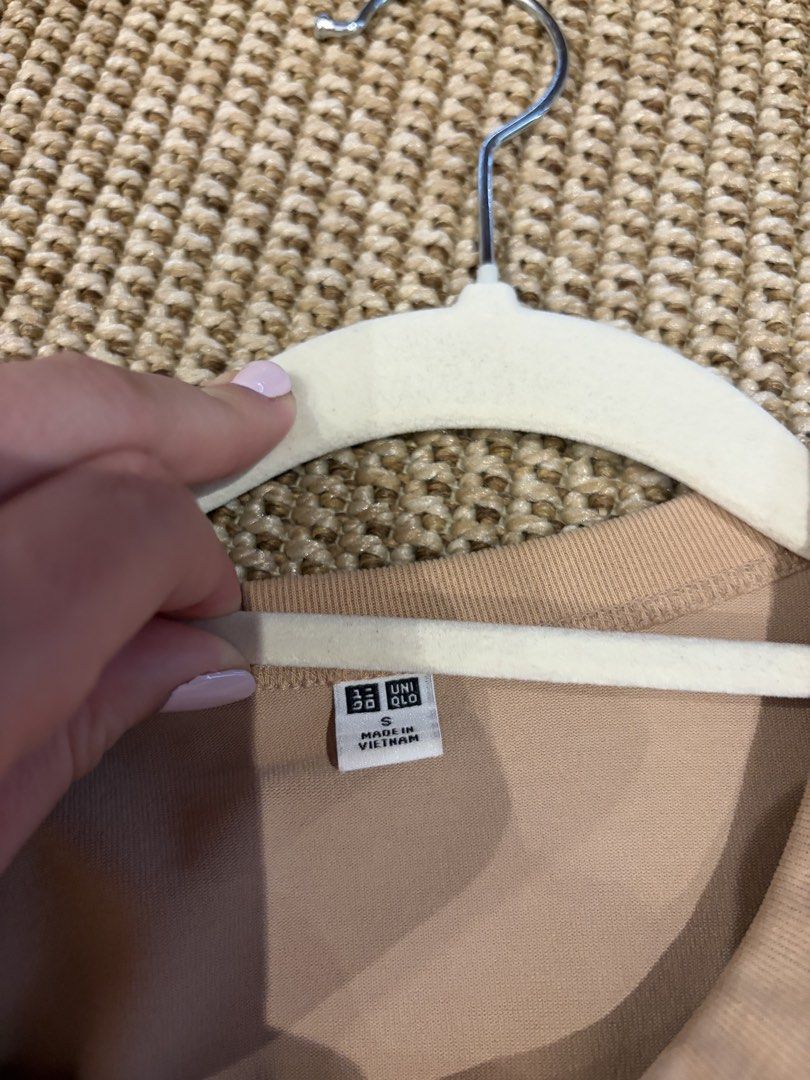 Uniqlo Beige Button-Up Cardigan Size S (Category: Coats, Jackets and Outerwear) located in Pasig City. Submitted by bfa1017 (Listing ID 1465656163, Image 2). Description: - Brand: Uniqlo - Size: S - Color: Neutral beige - Material: Smooth cotton feel (Made in Vietnam) - Design: Long sleeves, round neckline, front button closure, cropped length - Condition: Great everyday basic, easy to pair with jeans or skirts for layering.