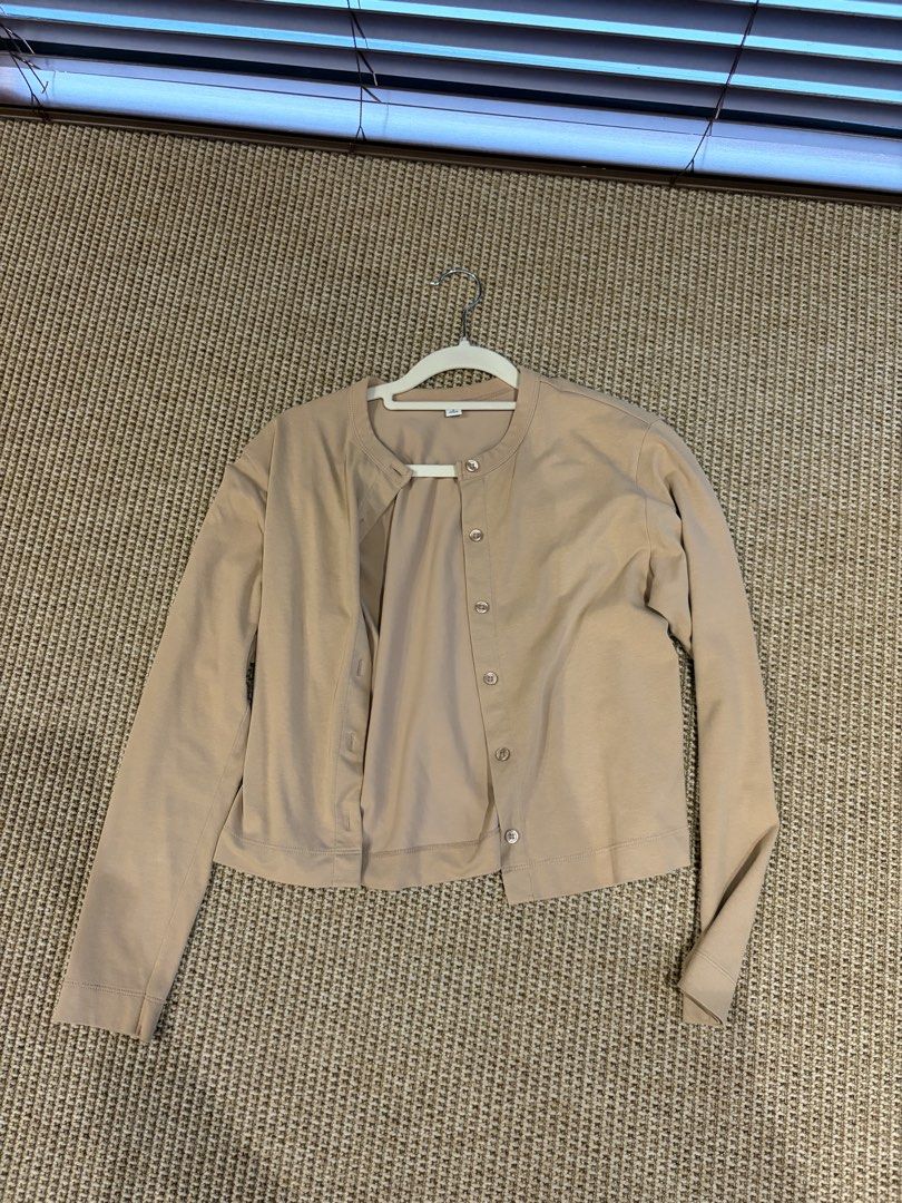Uniqlo Beige Button-Up Cardigan Size S (Category: Coats, Jackets and Outerwear) located in Pasig City. Submitted by bfa1017 (Listing ID 1465656163, Image 1). Description: - Brand: Uniqlo - Size: S - Color: Neutral beige - Material: Smooth cotton feel (Made in Vietnam) - Design: Long sleeves, round neckline, front button closure, cropped length - Condition: Great everyday basic, easy to pair with jeans or skirts for layering.