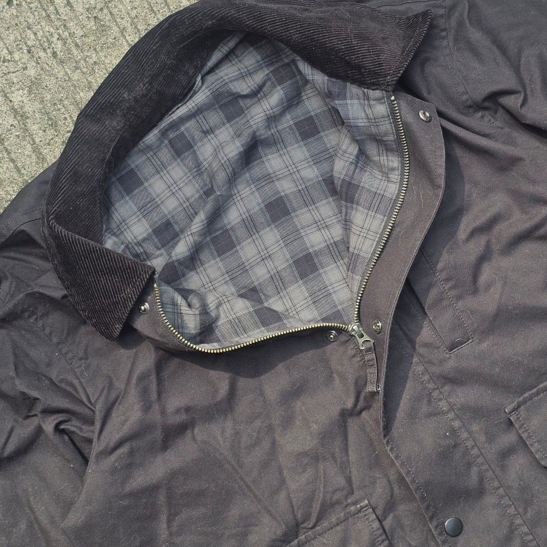 Uniqlo jacket (Category: Coats, Jackets and Outerwear) located in Dasmarinas. Submitted by thriftxstop (Listing ID 1465624930, Image 3). Description: - Style: Rugged utility field jacket / workwear - Material: Sturdy black cotton canvas with soft grey plaid flannel lining - Details: Classic contrasting dark brown corduroy collar and button cuffs - Closure: Full zipper combined with front snap buttons - Pockets: Large lower utility flap pockets an