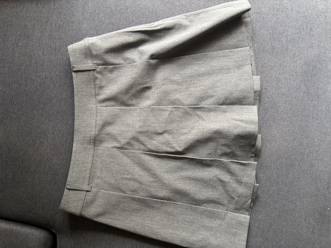 Uniqlo Pleated Skirt - Gray (Category: Skirts) located in Makati City. Submitted by kaysgarage (Listing ID 1465595993, Image 2). Description: - Brand: Uniqlo - Item: Pleated Skirts ( Gray) - size S - brand new with tag (with inner short) RFS: Lost weight and bought the wrong size.