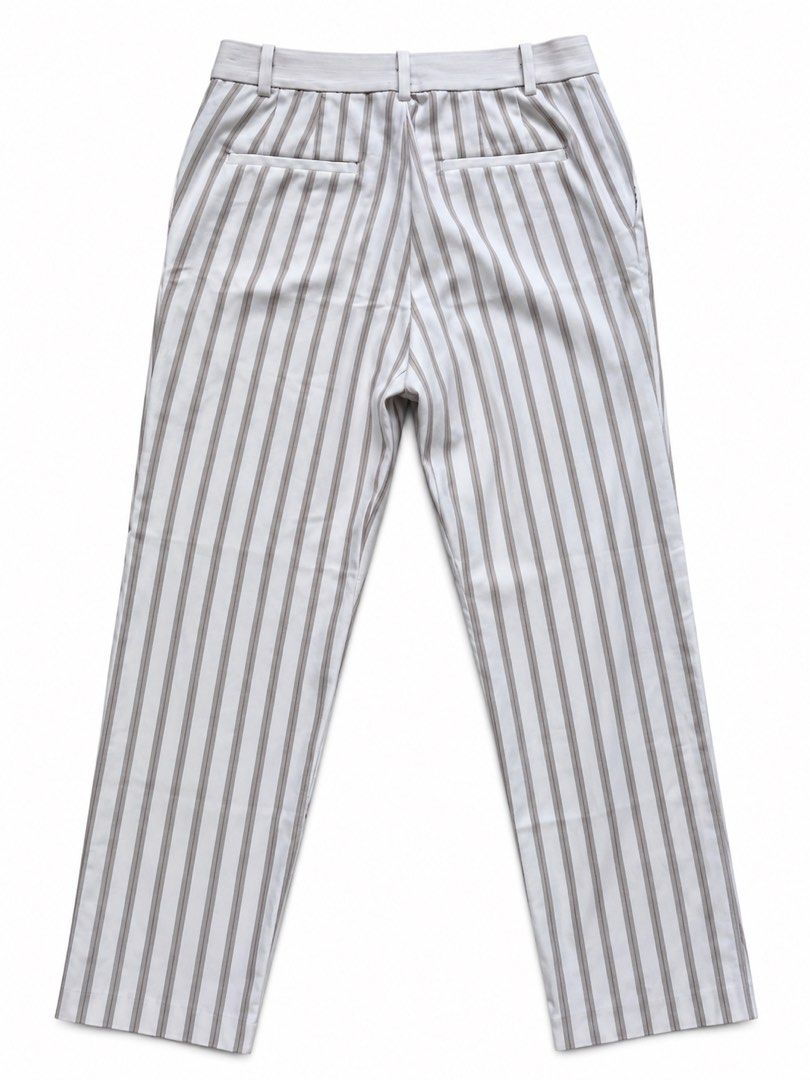 Uniqlo Striped Pants Size S (Category: Other Bottoms) located in Quezon City. Submitted by poshforward (Listing ID 1465654033, Image 2). Description: - Brand: Uniqlo - Size: S (fits waist 60-66 cm) - Design: Brown vertical stripes on white background - Cut: Straight leg - Pockets: Side pockets and back welt pockets - Condition: Clean and ready to wear LP na! Decluttering nang malupet! Practicing how to let go 😭.