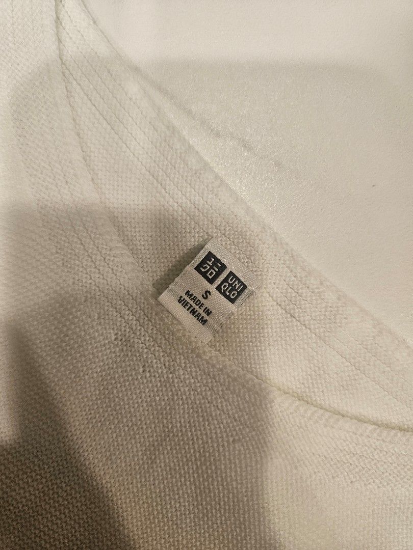 Uniqlo Short Sleeve Knits (Category: Shirts) located in Muntinlupa City. Submitted by aremvy (Listing ID 1465631595, Image 2). Description: Preloved Uniqlo Short Sleeves Knits - Color: White - Size: S - Material: 100% cotton with soft textured fabric - Design: Clean round neckline, short sleeves - Style: Classic basic piece, versatile for skirts or jeans - Care: Easy to wash and maintain - Condition: Great for everyday casual wear.
