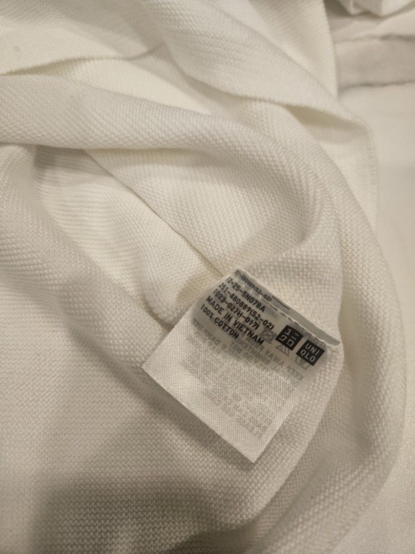 Uniqlo Short Sleeve Knits (Category: Shirts) located in Muntinlupa City. Submitted by aremvy (Listing ID 1465631595, Image 3). Description: Preloved Uniqlo Short Sleeves Knits - Color: White - Size: S - Material: 100% cotton with soft textured fabric - Design: Clean round neckline, short sleeves - Style: Classic basic piece, versatile for skirts or jeans - Care: Easy to wash and maintain - Condition: Great for everyday casual wear.