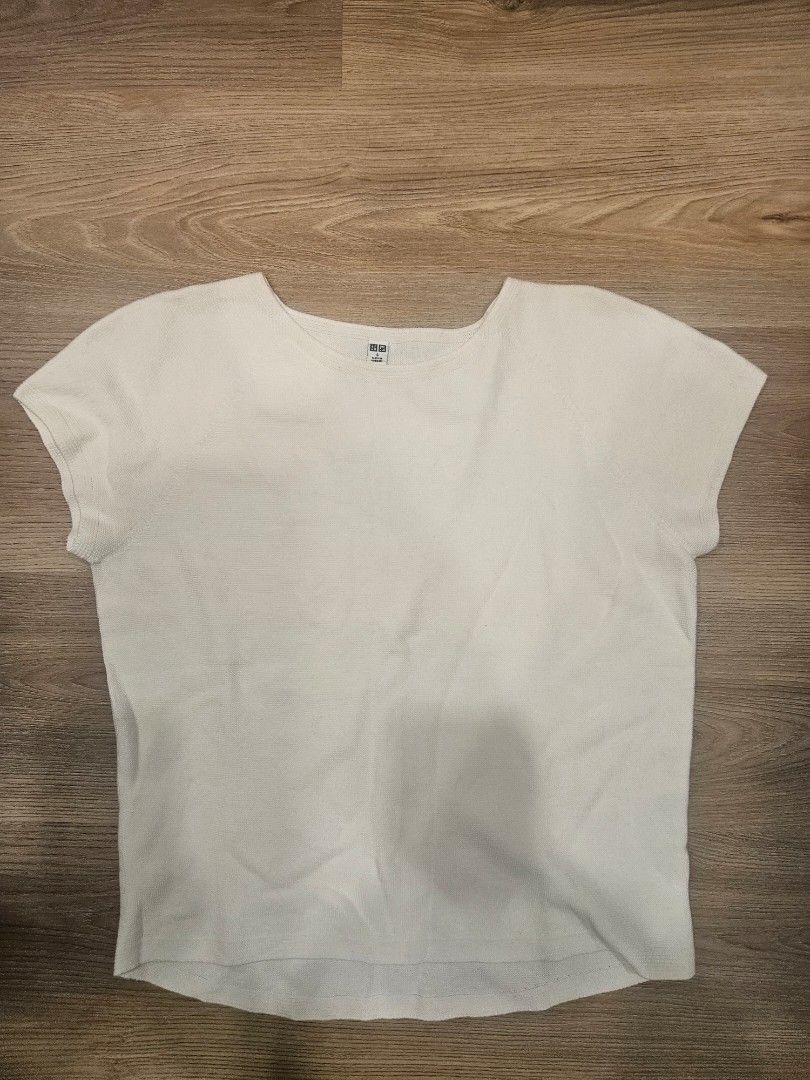 Uniqlo Short Sleeve Knits (Category: Shirts) located in Muntinlupa City. Submitted by aremvy (Listing ID 1465631595, Image 1). Description: Preloved Uniqlo Short Sleeves Knits - Color: White - Size: S - Material: 100% cotton with soft textured fabric - Design: Clean round neckline, short sleeves - Style: Classic basic piece, versatile for skirts or jeans - Care: Easy to wash and maintain - Condition: Great for everyday casual wear.