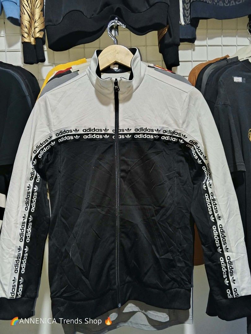 Unisex Jacket (Category: Coats, Jackets and Outerwear) located in Bulacan. Submitted by ukaybrandedshop (Listing ID 1465598204, Image 1). Description: Adidas Originals Taped Tracktop Jacket - Black / White - Size L PRICE: ₱600 *DESCRIPTION: 🔥 ADIDAS ORIGINALS TAPED TRACKTOP - LEGIT 🔥 Brand: Adidas Originals Color: White / Black - two tone, malinis Condition: 9.5/10 Excellent - No issue, zip smooth, print buo pa Material: 100% Polyester Recycled