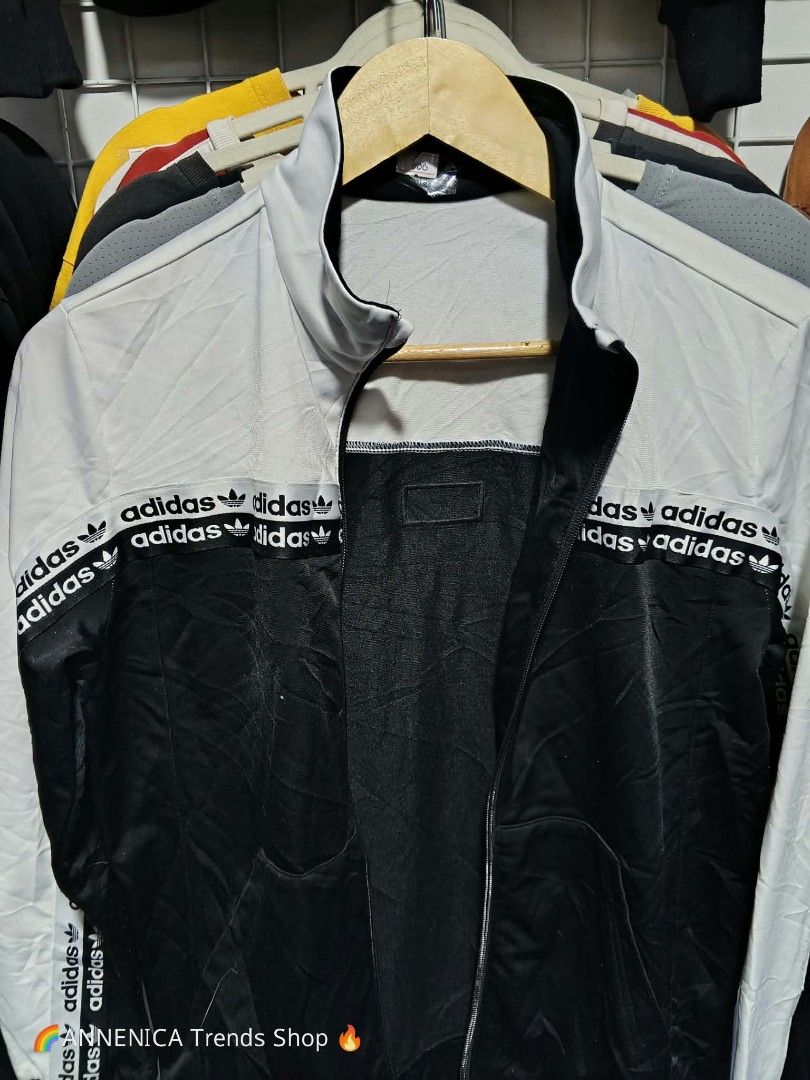 Unisex Jacket (Category: Coats, Jackets and Outerwear) located in Bulacan. Submitted by ukaybrandedshop (Listing ID 1465598204, Image 2). Description: Adidas Originals Taped Tracktop Jacket - Black / White - Size L PRICE: ₱600 *DESCRIPTION: 🔥 ADIDAS ORIGINALS TAPED TRACKTOP - LEGIT 🔥 Brand: Adidas Originals Color: White / Black - two tone, malinis Condition: 9.5/10 Excellent - No issue, zip smooth, print buo pa Material: 100% Polyester Recycled