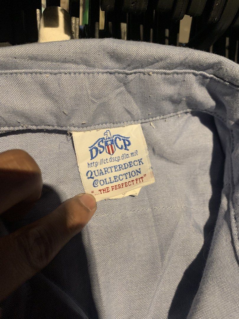 US Navy Utility Work Shirt Light Blue DSCP Quarterdeck Collection (Category: Tshirts & Polo Shirts ) located in Naga. Submitted by than09070539101 (Listing ID 1465748810, Image 2). Description: - Authentic US Navy utility work shirt from the DSCP Quarterdeck Collection - Color: Light blue - Material: 65% polyester and 35% cotton blend for durability and comfort - Design: Standard button-down front, classic collar, and two functional chest pockets