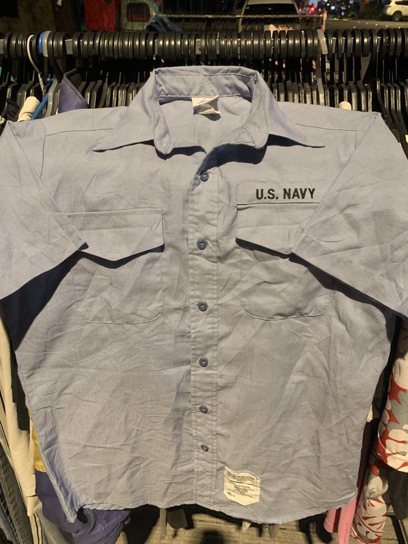 US Navy Utility Work Shirt Light Blue DSCP Quarterdeck Collection (Category: Tshirts & Polo Shirts ) located in Naga. Submitted by than09070539101 (Listing ID 1465748810, Image 1). Description: - Authentic US Navy utility work shirt from the DSCP Quarterdeck Collection - Color: Light blue - Material: 65% polyester and 35% cotton blend for durability and comfort - Design: Standard button-down front, classic collar, and two functional chest pockets