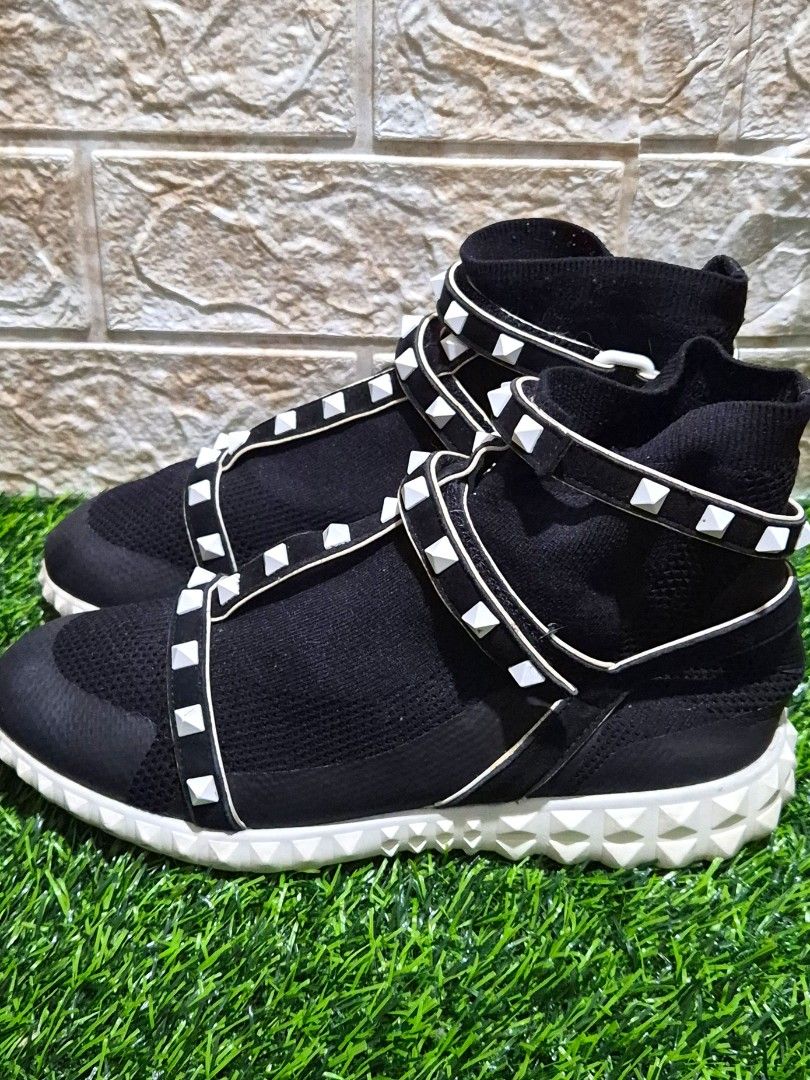 Valentino Garavani Rockstud Body Tech Sock Sneaker (Category: Sneakers & Footwear) located in Antipolo. Submitted by saribymonica (Listing ID 1465731224, Image 2). Description: Authentic Valentino Garavani Rockstud Body Tech Sock Sneakers Size: EU 36.5 (36 ½) Shoes only Design Features: Black technical knit sock upper featuring an adjustable Velcro ankle strap adorned with signature white rubber pyramid rockstuds and a ridged white rubber sole. E