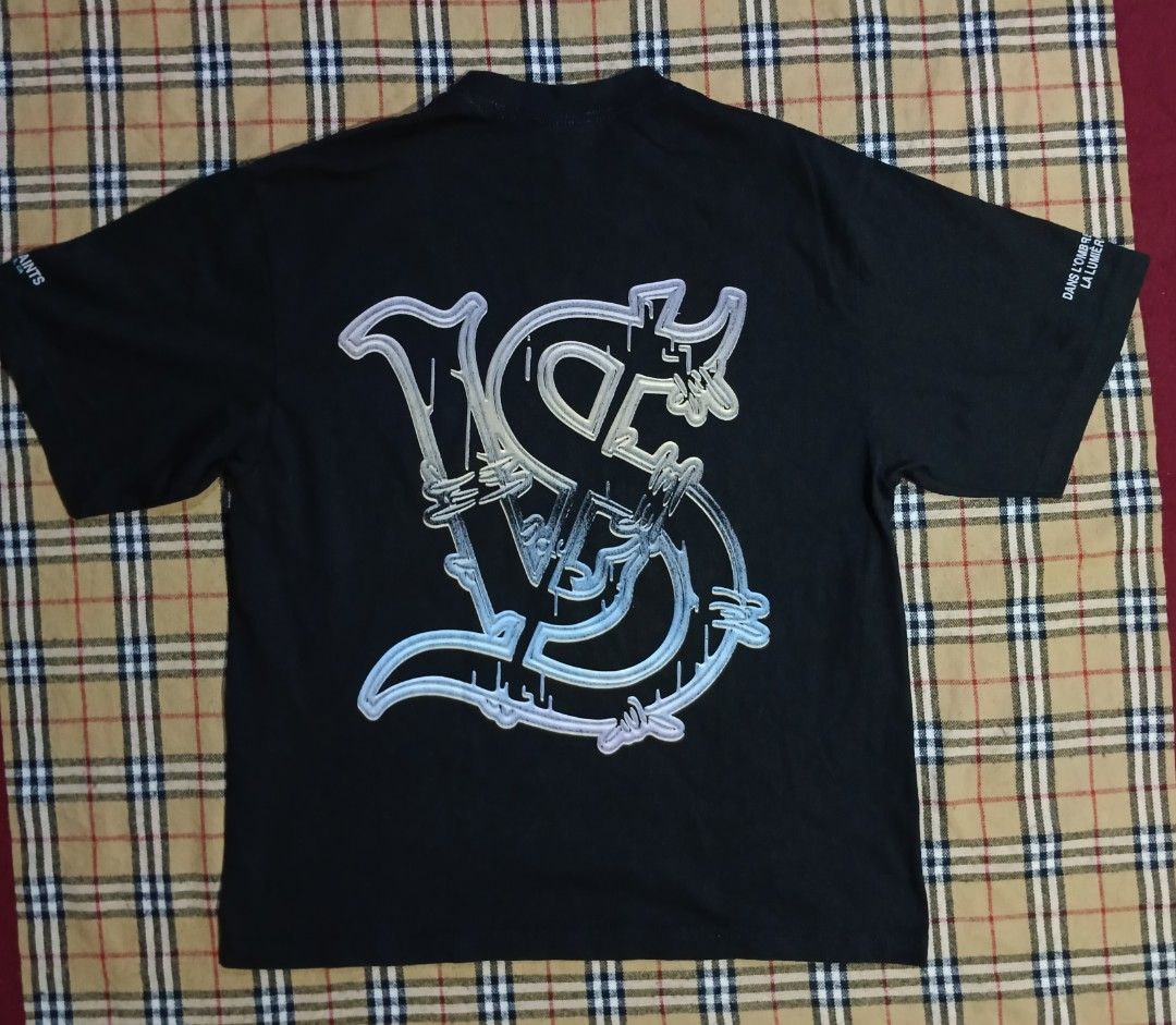 Valley Saints Graphic Print Cropped Tee (Category: Activewear) located in General Santos City (Dadiangas). Submitted by freehorse.5f2a61 (Listing ID 1465591165, Image 2). Description: - Brand/Model: Valley Saints on Shaka Wear Super Max Heavy cropped blank - Size: Large - Color: Black - Material: 100% Cotton, made in Honduras (thick and heavy quality) - Design: Sci-fi front graphic, large VS logo on the back, and sleeve prints featuring Los Angel