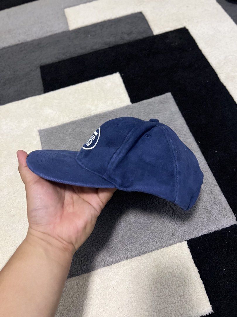 Vans Blue Oval Logo Snapback Cap (Category: Caps & Hats) located in Calasiao. Submitted by pb.supply_v2 (Listing ID 1465752532, Image 2). Description: - Brand: Vans - Color: Classic Navy Blue with white embroidered oval logo - Design: Six-panel unstructured build with metal eyelets for breathability - Fit: Adjustable snapback closure for a custom fit - Style: Versatile everyday casual streetwear.