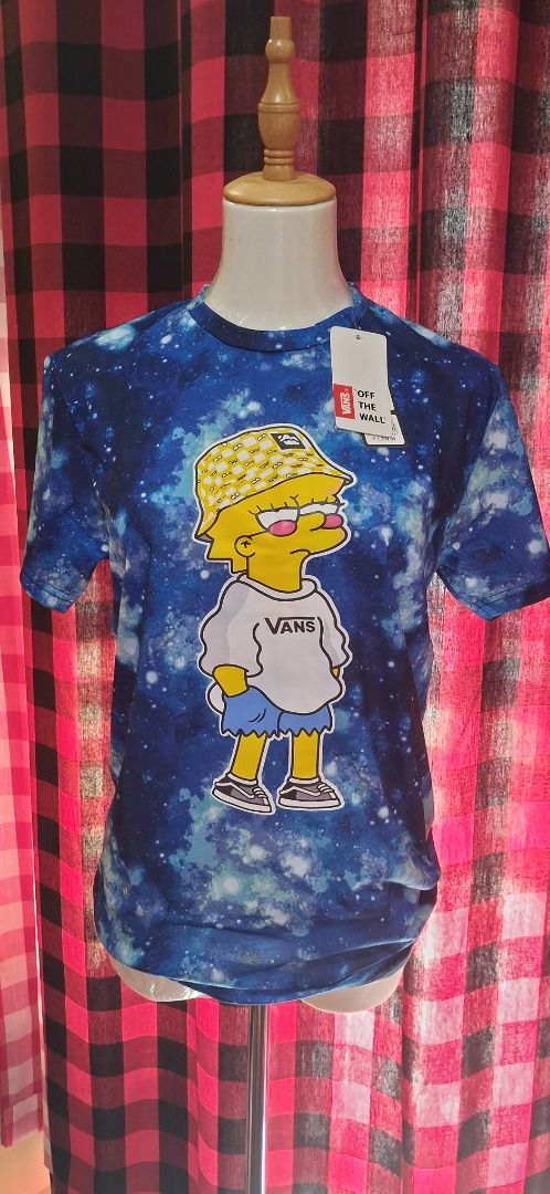 Vans Space Graphic T-Shirt Size M (Category: Tshirts & Polo Shirts ) located in Manila. Submitted by katkween23 (Listing ID 1465633369, Image 3). Description: - Brand: Vans - Design: Blue space galaxy print with Bart/Lisa Simpson character in bucket hat and Vans - Size: Medium - Material: 100% cotton - Condition: Brand new with original tags - Style: Classic streetwear, perfect for everyday wear.