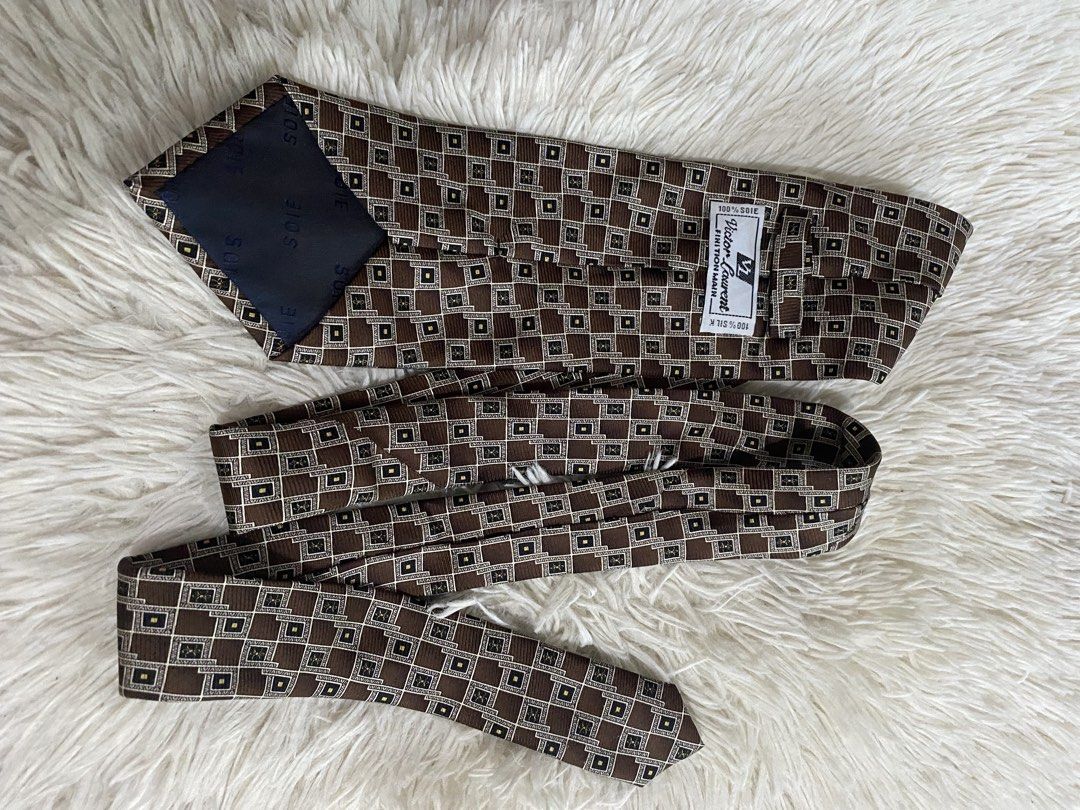 Victor Laurent 100% Silk Brown Geometric Tie (Category: Ties) located in Bulacan. Submitted by rich2545 (Listing ID 1465581293, Image 2). Description: - Brand: Victor Laurent - Material: 100% Soie Silk (Handmade finish) - Design: Brown with geometric gold and white square details - Width: Standard - Condition/Details: Clean lining on the back - Ideal for: Work, meetings, or formal events.
