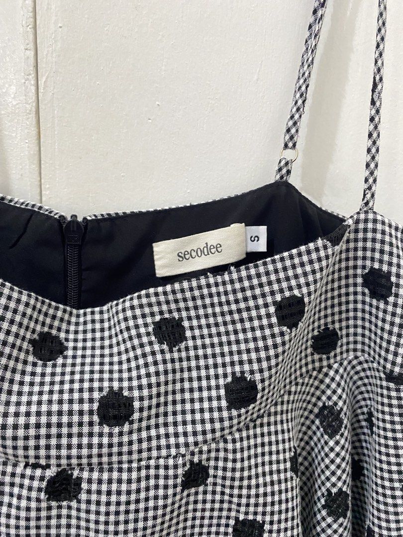 Vietnam Secodee Black and White Gingham Polka Dot Top Size S (Category: Sleeveless) located in Manila. Submitted by kooarchives (Listing ID 1465588211, Image 3). Description: - Sorry got this for 1500 :( - Brand: Secodee - Size: Small (tag attached) - Pattern: Black and white gingham with textured black polka dots - Details: Adjustable spaghetti straps, square neckline, back zipper closure - Style: Layered ruffle flare silhouette - Condition: Cle