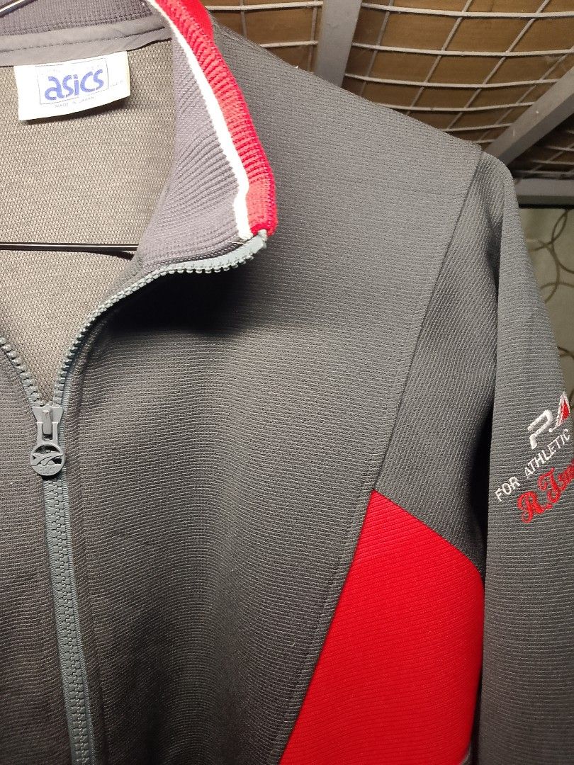 ​Vintage ASICS Full-Zip Track Jacket for Sale! (Category: Coats, Jackets and Outerwear) located in Manila. Submitted by red09845 (Listing ID 1465749671, Image 3). Description: ​Details: Authentic retro ASICS track jacket from Japan. Features a stylish charcoal gray colorway with bold red and white panel accents, striped ribbed trim, and unique "P.A.W. For Athletic World" sleeve branding. ​Condition: Pre-loved in great vintage condition with clean