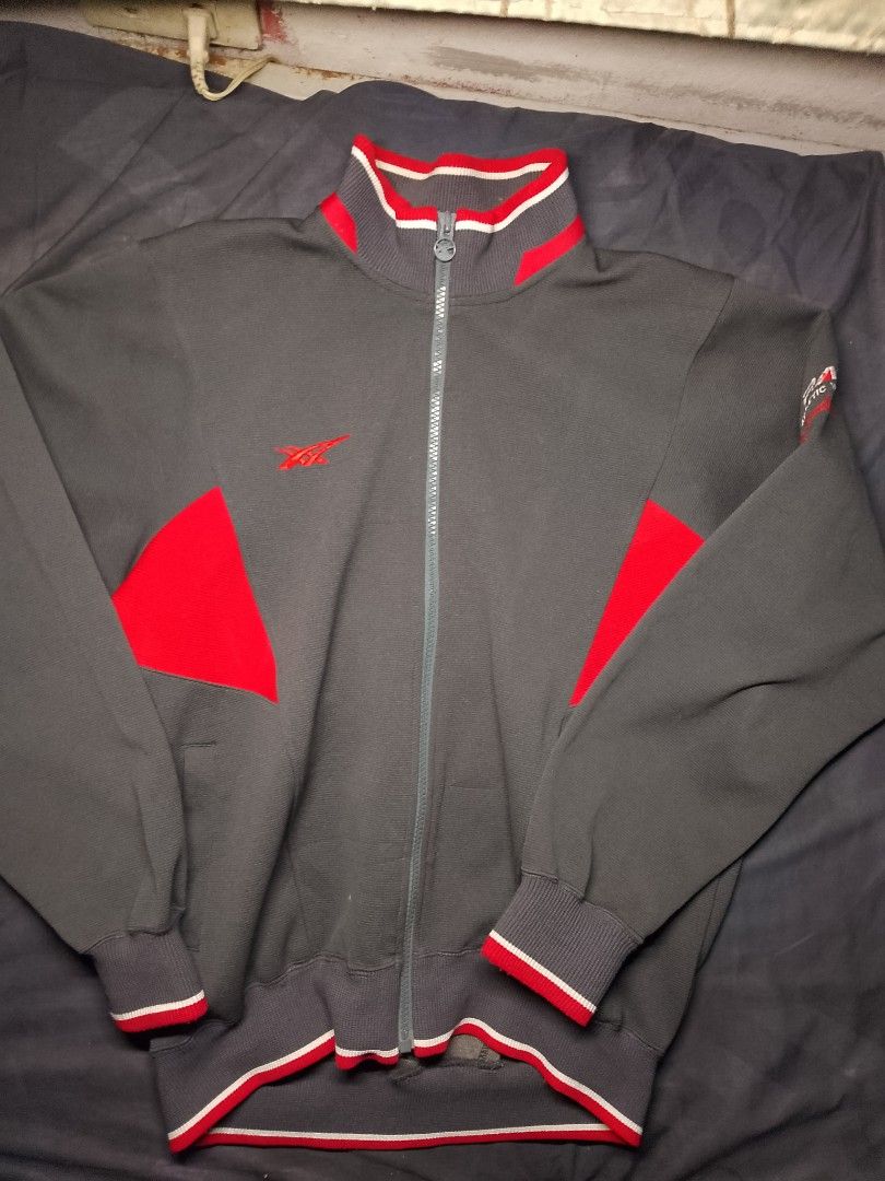​Vintage ASICS Full-Zip Track Jacket for Sale! (Category: Coats, Jackets and Outerwear) located in Manila. Submitted by red09845 (Listing ID 1465749671, Image 1). Description: ​Details: Authentic retro ASICS track jacket from Japan. Features a stylish charcoal gray colorway with bold red and white panel accents, striped ribbed trim, and unique "P.A.W. For Athletic World" sleeve branding. ​Condition: Pre-loved in great vintage condition with clean