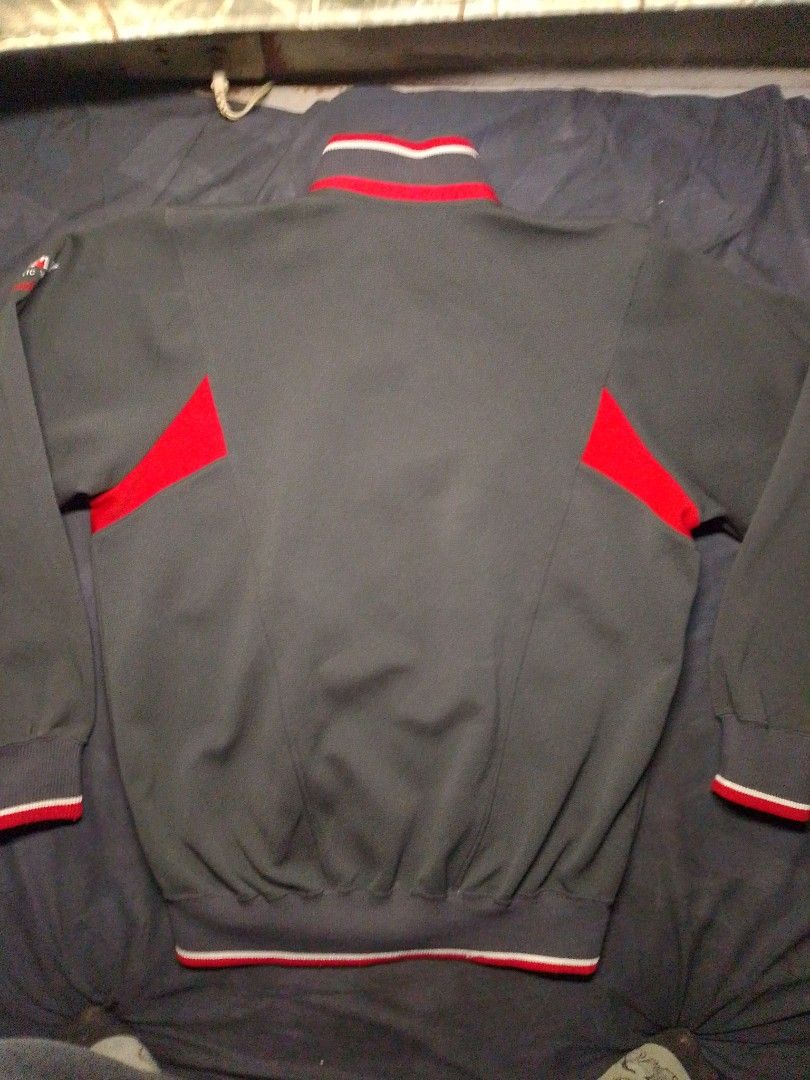 ​Vintage ASICS Full-Zip Track Jacket for Sale! (Category: Coats, Jackets and Outerwear) located in Manila. Submitted by red09845 (Listing ID 1465749671, Image 2). Description: ​Details: Authentic retro ASICS track jacket from Japan. Features a stylish charcoal gray colorway with bold red and white panel accents, striped ribbed trim, and unique "P.A.W. For Athletic World" sleeve branding. ​Condition: Pre-loved in great vintage condition with clean