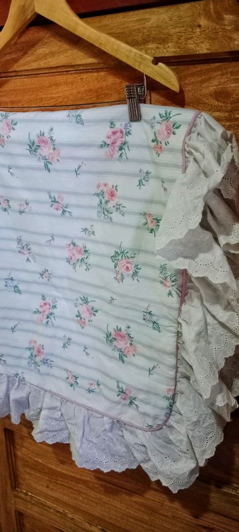 Vintage Floral Pattern Long Pillowcase with white eyelet ruffle (Category: Bedding & Towels) located in Mangaldan. Submitted by closetqwin (Listing ID 1465636558, Image 2). Description: - With black ink stain as seen in the 3rd and 4th pictures -Size 37.5 inches Length and 18.5 inches Width - Beautiful ruffled eyelet lace trim around the edges - Convenient envelope closure on the back - Perfect for adding a shabby chic or cottagecore vibe to your