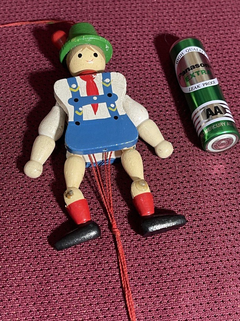 vintage Jumping Jack toy,(Hampelmann) (Category: Interactive Toys) located in Manila. Submitted by dstrangerthings (Listing ID 1465673938, Image 2). Description: This is a traditional German wooden Jumping Jack toy, also known as a Hampelmann. It is a jointed flat wooden figure with a pull string at the bottom. When the string is pulled, the figure’s arms and legs move up and down, making it “jump”. The toy is hand-painted and often used as a han