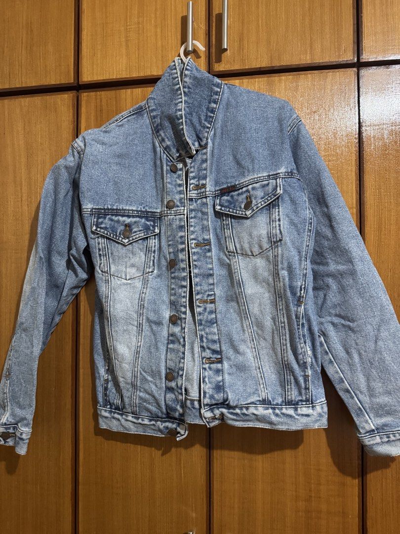 Vintage light wash denim jacket with button pockets (Category: Coats, Jackets and Outerwear) located in Santa Cruz, Pampanga. Submitted by eygee_rp (Listing ID 1465724521, Image 1). Description: - Classic light wash denim jacket - Button-up front with durable metal hardware - Functional storage: 2 chest flap pockets and 2 lower side pockets - Long sleeves with button cuffs and a stylish high collar design - Versatile layering piece that matches a