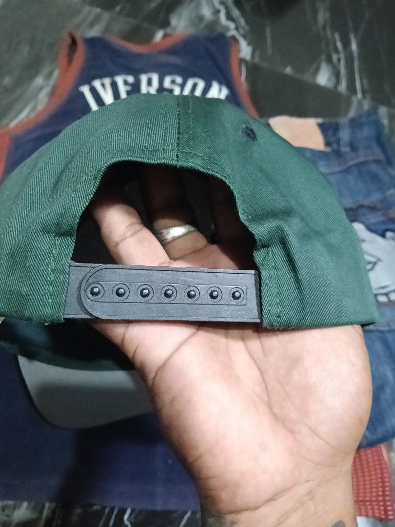 Vintage New York Jets Logo Athletic Snapback Hat (Category: Caps & Hats) located in Manila. Submitted by jahwang1973 (Listing ID 1465610556, Image 2). Description: - Brand: Logo Athletic - Team: New York Jets - Color: Green and black with grey brim underside - Details: Embroidered team logo patch on the front, adjustable plastic snapback strap - Condition: Vintage piece with some yellowing on the white inner lining from age and use - Origin: Made