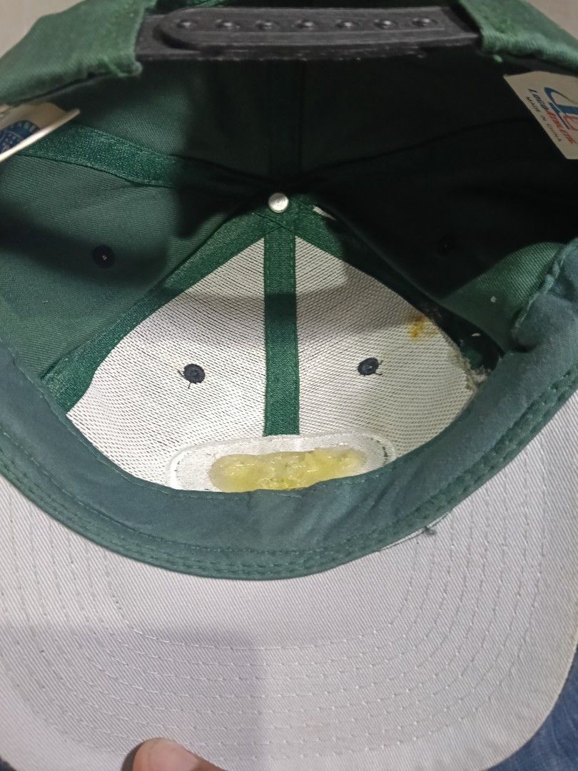 Vintage New York Jets Logo Athletic Snapback Hat (Category: Caps & Hats) located in Manila. Submitted by jahwang1973 (Listing ID 1465610556, Image 3). Description: - Brand: Logo Athletic - Team: New York Jets - Color: Green and black with grey brim underside - Details: Embroidered team logo patch on the front, adjustable plastic snapback strap - Condition: Vintage piece with some yellowing on the white inner lining from age and use - Origin: Made