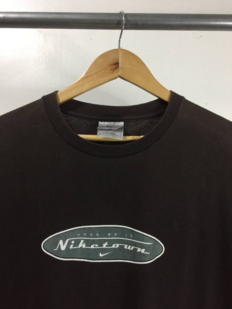 Vintage Nike Town (Category: Tshirts & Polo Shirts ) located in Balayan. Submitted by _wethrift (Listing ID 1465745203, Image 2). Description: Vintage Nike Town - size XL - dimension 23 x 31.5 - good condition - color rate 8/10 - good fade / hairlines cracks MINE - 📩 +shipping fee 📍 BALAYAN, BATANGAS.