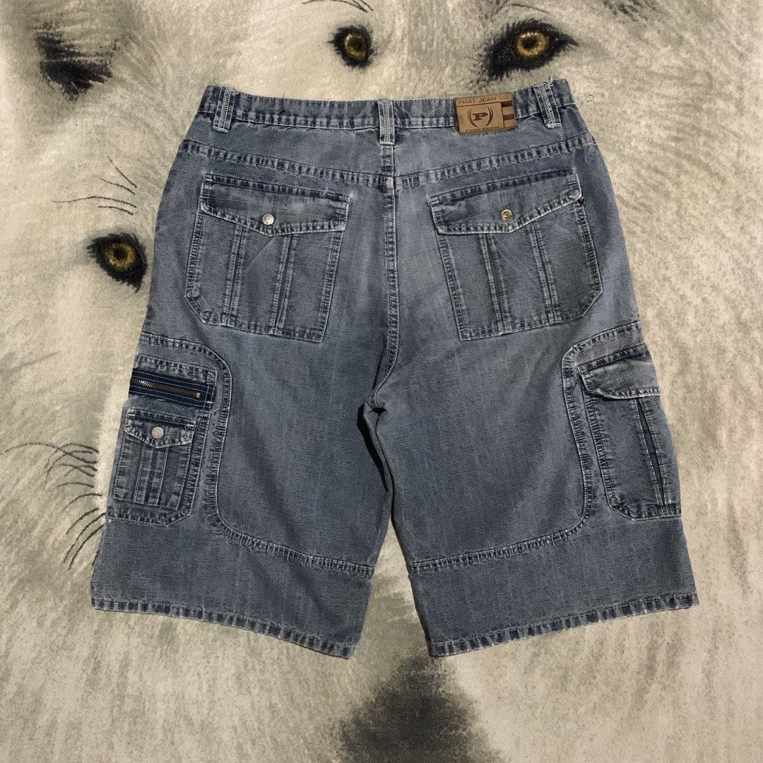 Vintage Phat Farm Denim Cargo (Category: Shorts) located in Bulacan. Submitted by puronghustlin (Listing ID 1465659556, Image 2). Description: - Brand: Phat Farm - Style: Baggy Y2K skater fit denim cargo shorts - Wash: Faded blue - Details: Multiple utility pockets with zippers and buttons, leather brand patch on back waist - Material: Heavyweight, durable denim - Condition: Great streetwear staple, perfect for summer -37x27.