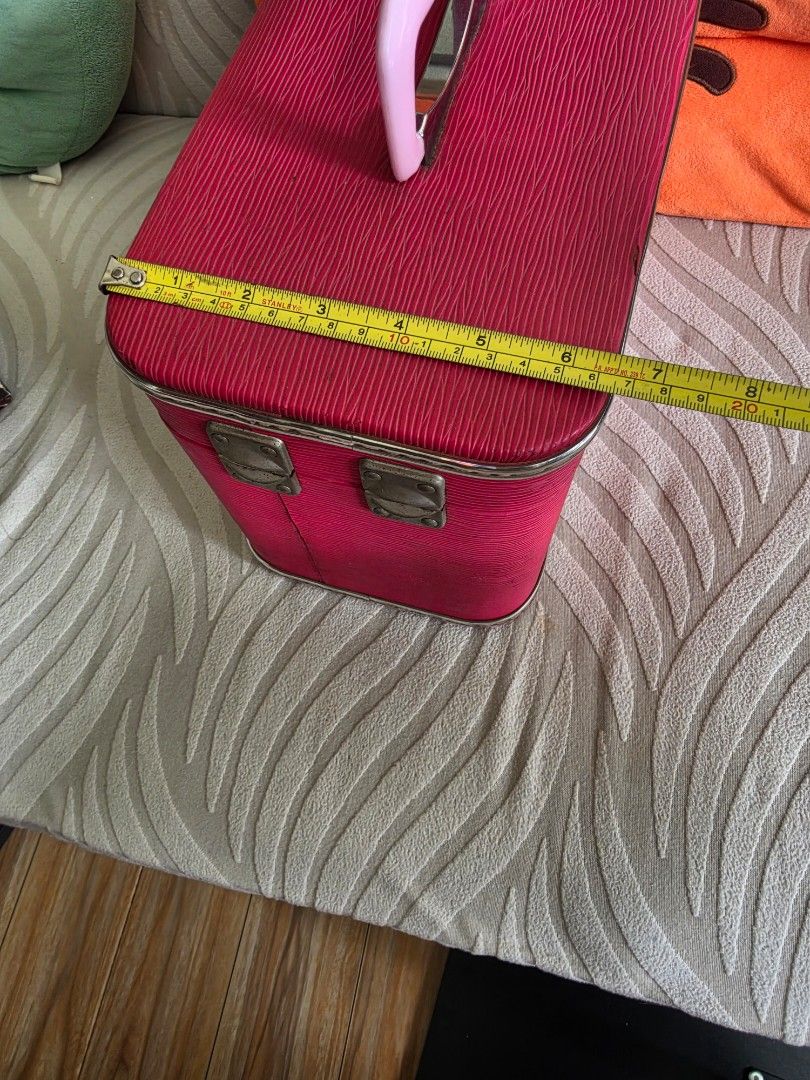 Vintage Pink Textured Vanity Case Makeup Train Box (Category: Purses & Pouches) located in Quezon City. Submitted by deng43763 (Listing ID 1465709777, Image 2). Description: - Color/Design: Bright pink textured finish with a classic rigid frame - Size: Measures approx. 20 cm across and 15 cm deep - Features: Sturdy pink handle and secure metal latches - Condition: Clean interior space, ready to use - Best for: Travel, makeup storage, toiletries, 