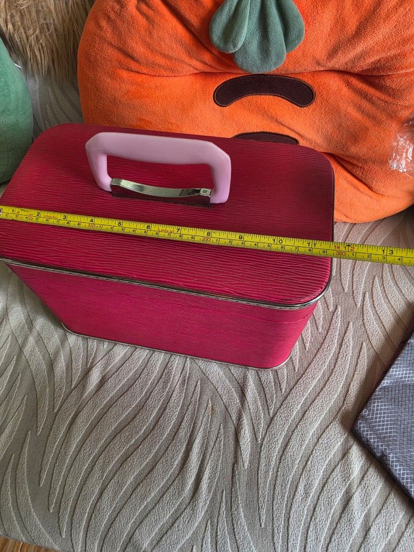 Vintage Pink Textured Vanity Case Makeup Train Box (Category: Purses & Pouches) located in Quezon City. Submitted by deng43763 (Listing ID 1465709777, Image 3). Description: - Color/Design: Bright pink textured finish with a classic rigid frame - Size: Measures approx. 20 cm across and 15 cm deep - Features: Sturdy pink handle and secure metal latches - Condition: Clean interior space, ready to use - Best for: Travel, makeup storage, toiletries, 