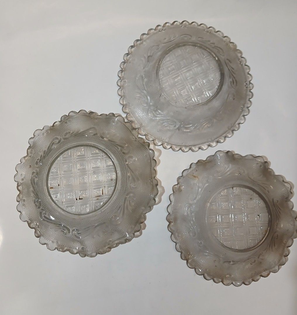 Vintage pressed clear glass plates (Category: Vintage Collectibles) located in Manila. Submitted by thecollectibleshop (Listing ID 1465620019, Image 2). Description: Vintage pressed clear glass plates featuring a grid center and scroll border. Buyer pays for the shipping fee..
