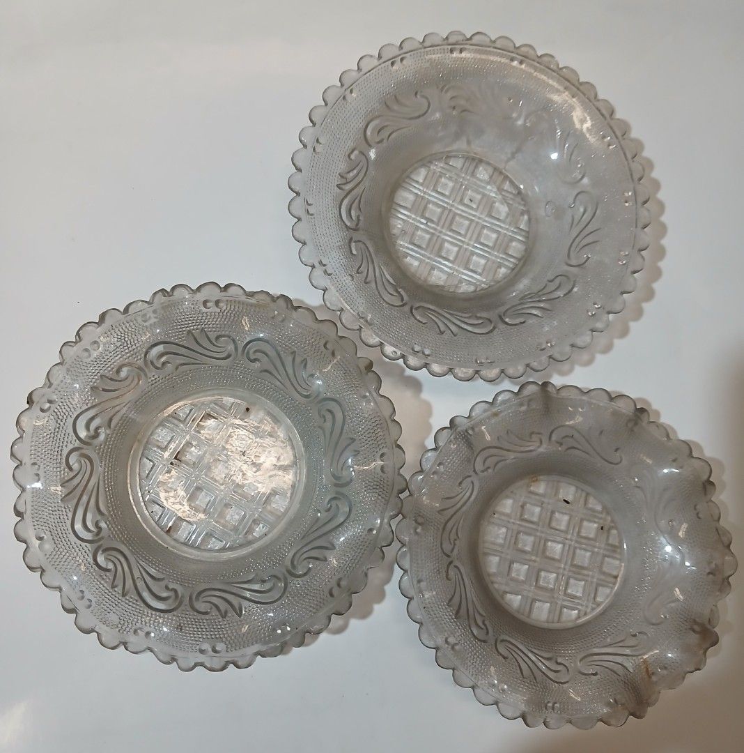 Vintage pressed clear glass plates (Category: Vintage Collectibles) located in Manila. Submitted by thecollectibleshop (Listing ID 1465620019, Image 1). Description: Vintage pressed clear glass plates featuring a grid center and scroll border. Buyer pays for the shipping fee..