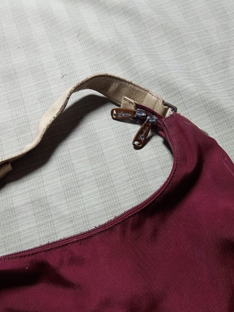Vintage Puma Shoulder Bag (Category: Shoulder Bags) located in Pasay City. Submitted by jay_gdz (Listing ID 1465748760, Image 3). Description: - Brand: Puma - Script Puma logo on front, compact hobo shape, secure zipper closure with custom pull tabs - Condition: Excellent - Shipping: Ships nationwide via J&T Express 1k shipped.