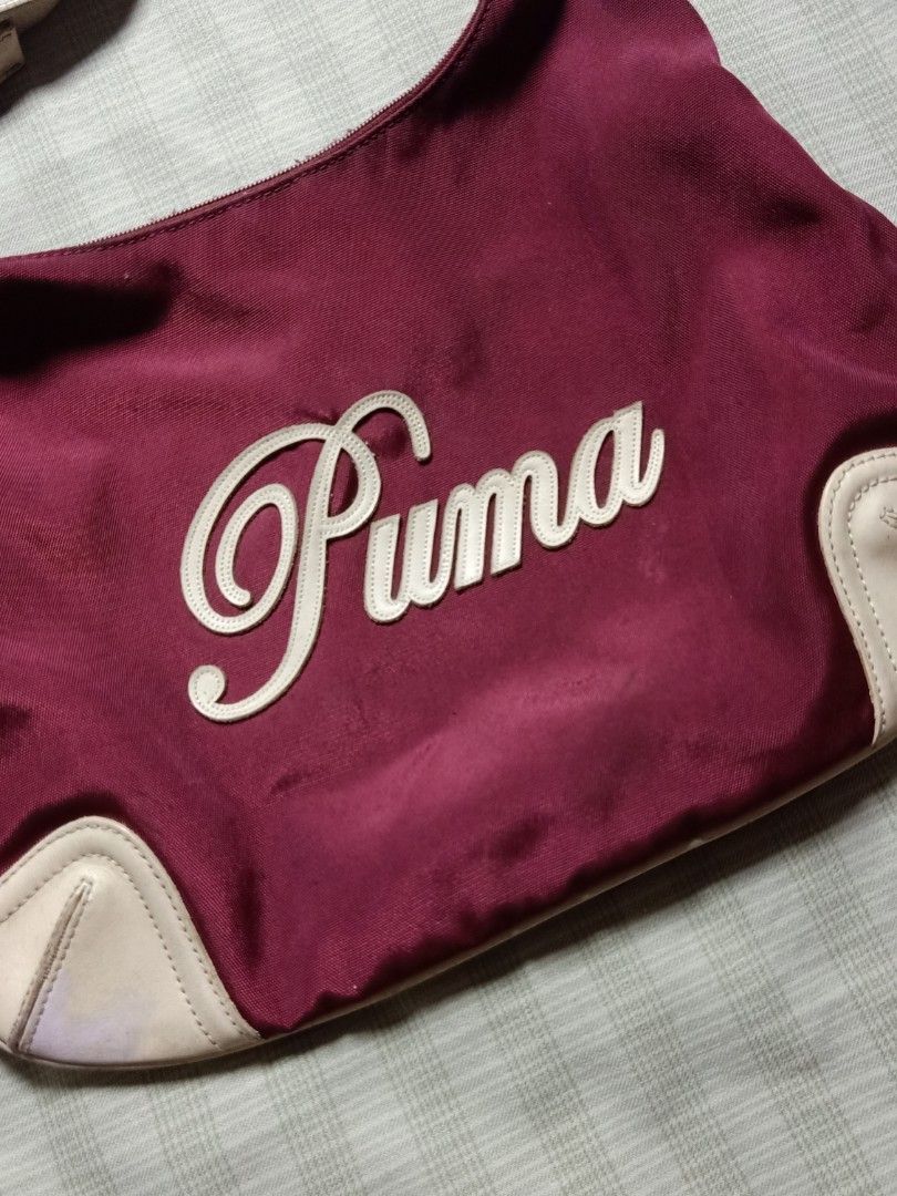Vintage Puma Shoulder Bag (Category: Shoulder Bags) located in Pasay City. Submitted by jay_gdz (Listing ID 1465748760, Image 2). Description: - Brand: Puma - Script Puma logo on front, compact hobo shape, secure zipper closure with custom pull tabs - Condition: Excellent - Shipping: Ships nationwide via J&T Express 1k shipped.