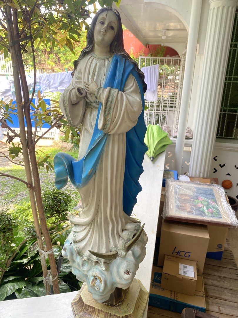 Vintage Religious Statue Virgin Mary Catholic (Category: Religious Items) located in Malolos. Submitted by jjantiques (Listing ID 1465636775, Image 1). Description: Vintage Religious Statue Virgin Mary Catholic Material: wood Size: 31 inches - Large vintage statue of the Virgin Mary - Traditional blue and white robes on a cloud base - Condition note: Shows noticeable weathering, cracking around the face, and missing right hand - Perfect classic d