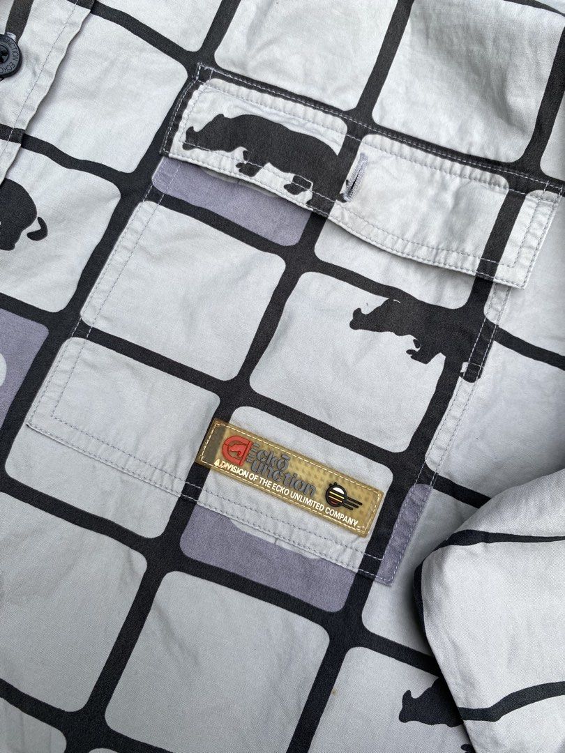 Vintage Y2K Ecko Function AOP Rhino Grid Button-Down Longsleeve (Category: Tshirts & Polo Shirts ) located in Calabanga. Submitted by 4405.curator (Listing ID 1465596026, Image 3). Description: Up for grabs is this super rare and authentic vintage Y2K Ecko Function button-down longsleeve. It features an awesome all-over print (AOP) with a rhino grid pattern in gray tones, complete with branded patches and logo taping inside the collar. Size M, fi