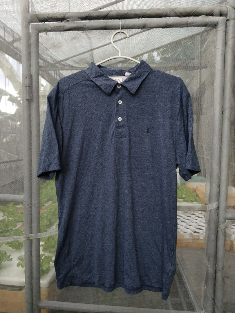 Volcom Polo Shirt (Category: Tshirts & Polo Shirts ) located in Legazpi City. Submitted by genobecollectives (Listing ID 1465654439, Image 1). Description: Volcom polo shirt 580 free ship 21 x 28 - Color: Blue heathered - Material: Soft fabric blend - Details: Short sleeves, standard 3-button collar, embroidered stone logo on chest - Special Features: Branded side seam and upper back tags, stylish asymmetrical seaming across the back - very good 